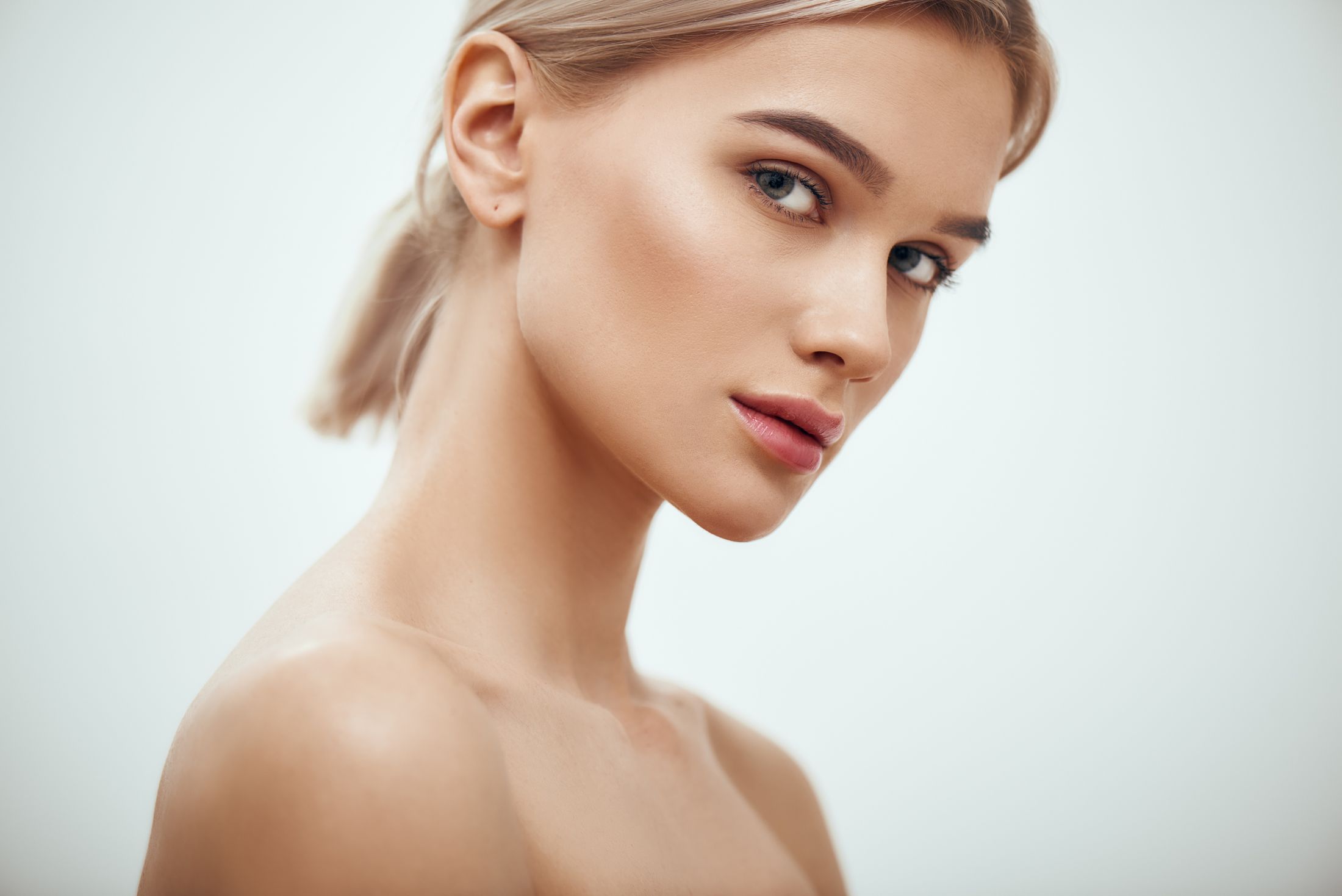 Profile shot of a woman with natural makeup.